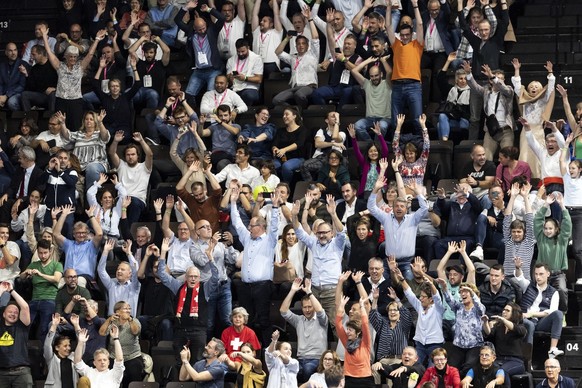 Spectators cheer during the round of eight match between Stan Wawrinka of Switzerland and Brandon Nakashima of the United States at the Swiss Indoors tennis tournament at the St. Jakobshalle in Basel, ...