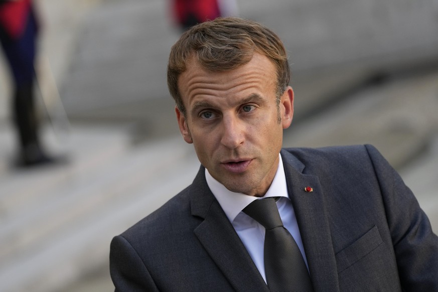 French President Emmanuel Macron, left, attends a joint press conference with Lebanese Prime Minister Najib Mikati after their meeting at the Elysee Palace, in Paris, Friday, Sept. 24, 2021. Despite F ...