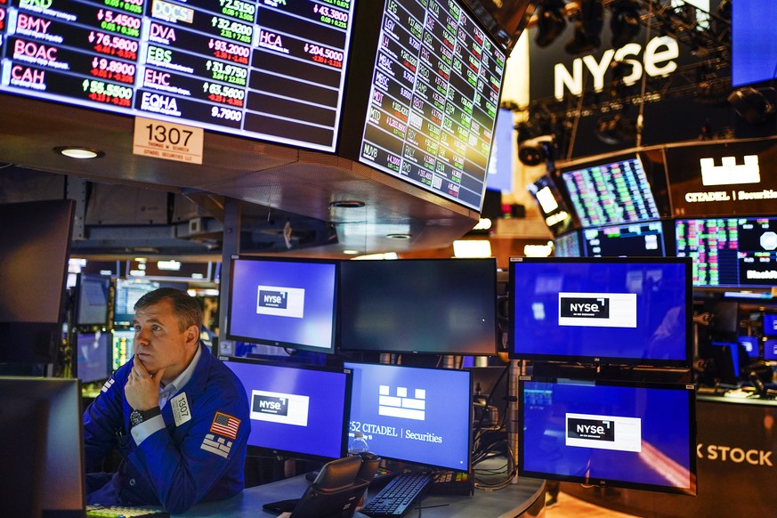 FILE - A trader works on the floor at the New York Stock Exchange in New York, Thursday, May 19, 2022. This year&#039;s sell-off for Wall Street means stocks no longer look to be in a dangerously over ...