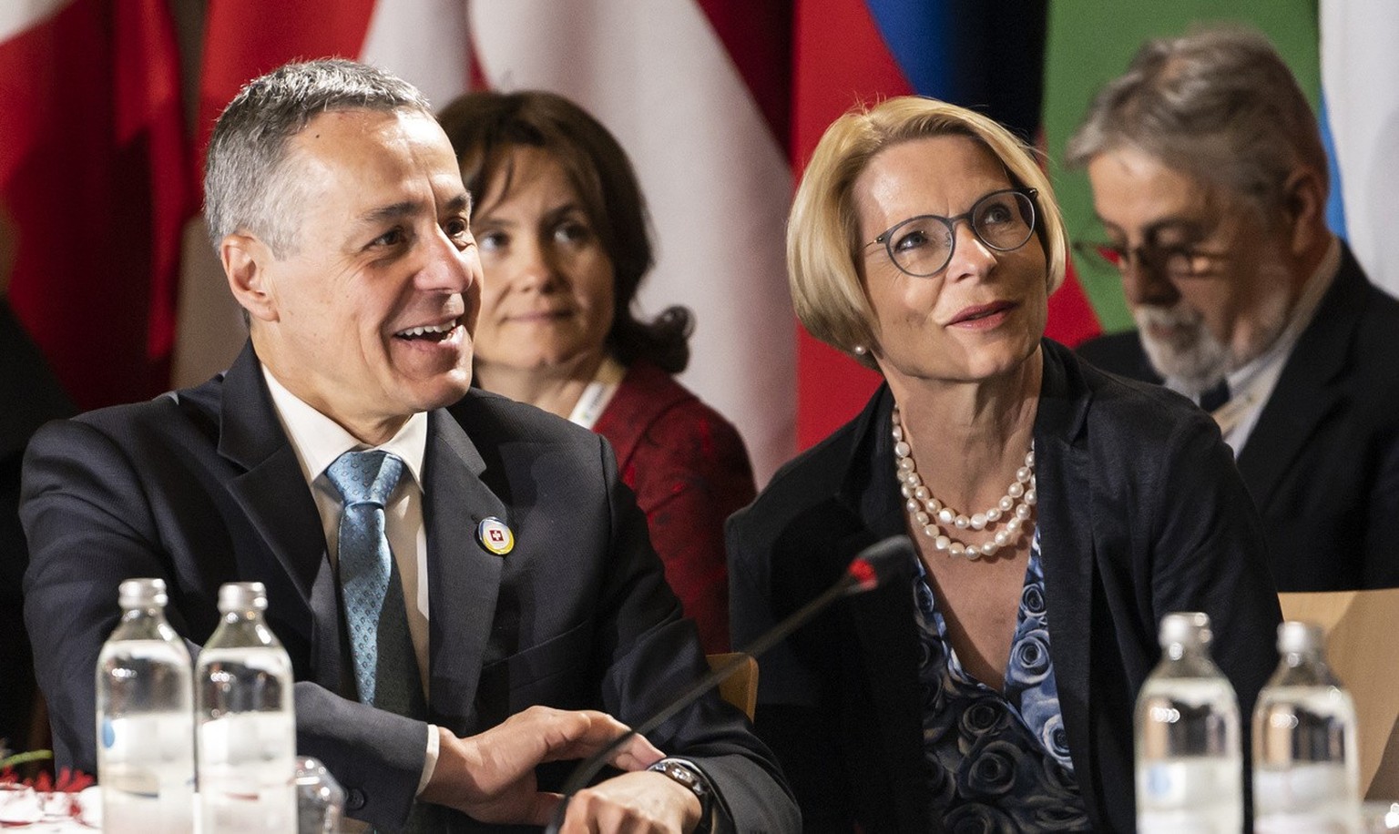 Swiss President Ignazio Cassis, Minister of Foreign Affairs, left, confers with Swiss State Secretary Livia Leu ahead of the round of national statements during the second day of the Ukraine Recovery  ...