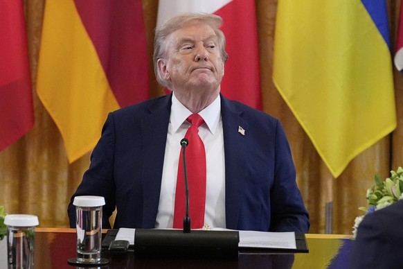 President Donald Trump participates in a meeting with Ukrainian President Volodymyr Zelenskyy and European leaders in the East Room of the White House, Monday, Aug. 18, 2025, in Washington. (AP Photo/ ...