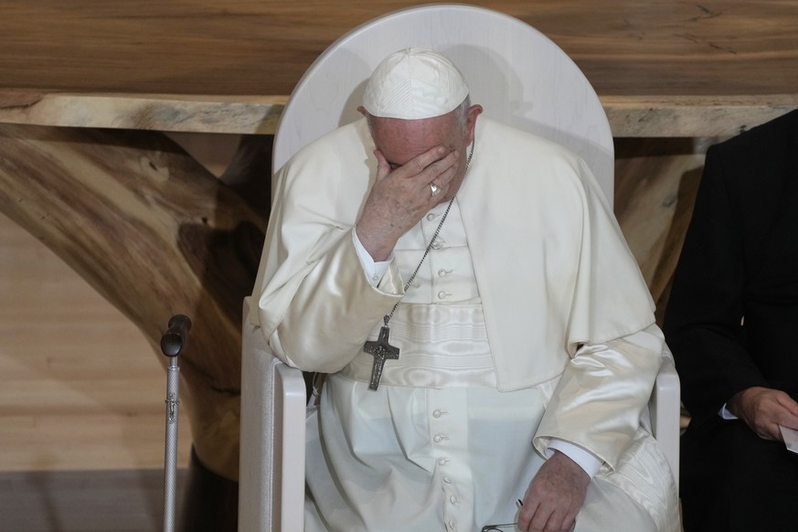 Pope Francis sits during a meeting with Indigenous peoples and members of the parish community of Sacred Heart in Edmonton, Canada, Monday, July 25, 2022. Pope Francis begins a &quot;penitential&quot; ...