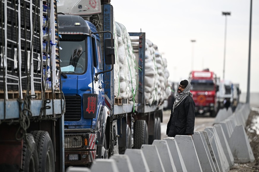 epa11921612 Truck drivers wait to cross the Rafah Border Crossing, between Egypt and the Gaza Strip, in Rafah, North Sinai Governorate, Egypt, 24 February 2025. As part of the Israel-Hamas ceasefire d ...