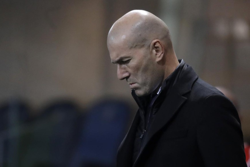 Real Madrid&#039;s head coach Zinedine Zidane walks on the touchline ahead the Champions League, round of 16, first leg soccer match between Atlanta and Real Madrid, at the Gewiss Stadium in Bergamo,  ...