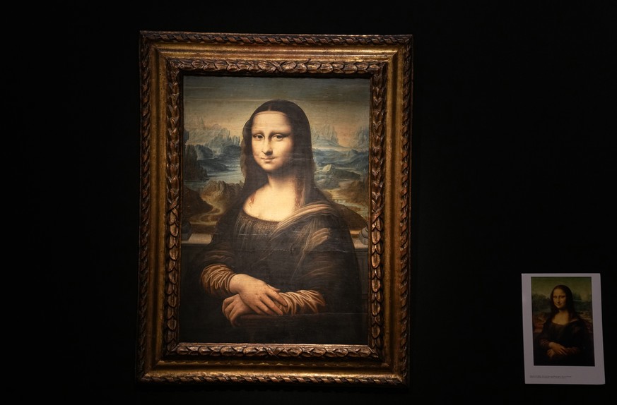 The copy of Leonardo da Vinci's famous Mona Lisa, painted on a panel around 1600, is displayed at the Artcurial auction house in Paris, Monday, Nov. 8, 2021. Incredibly faithful to the original, ...