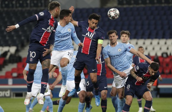 PSG&#039;s Marquinhos, center, scores his sides first goal during the Champions League semifinal first leg soccer match between Paris Saint Germain and Manchester City at the Parc des Princes stadium, ...