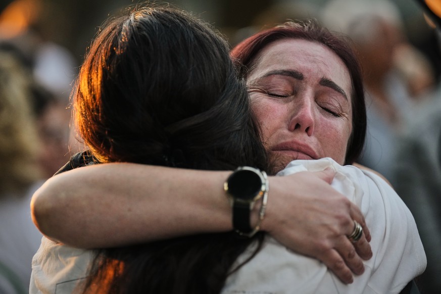 People attend a memorial service marking the third anniversary of the Oct. 7, 2023, Hamas cross-border attack on Israel, in Kibbutz Kfar Aza, southern Israel, where many community members were killed  ...