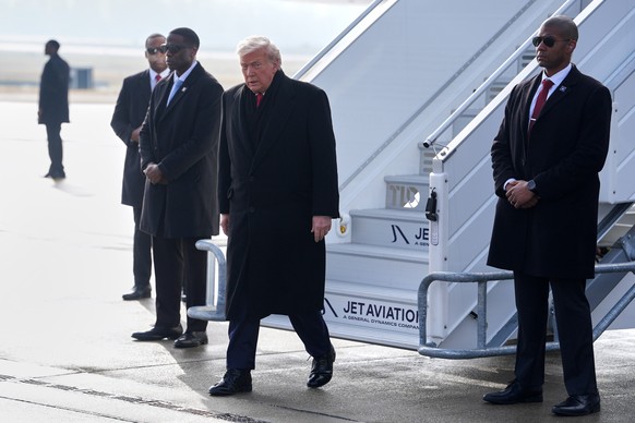 President Donald Trump steps off Air Force One after arriving at Zurich International Airport for the World Economic Forum, Wednesday, Jan. 21, 2026, in Zurich, Switzerland. (AP Photo/Evan Vucci)
