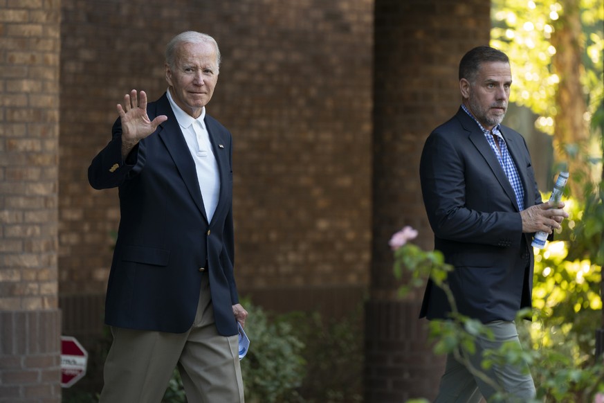 President Joe Biden with his son Hunter Biden waves as they leave Holy Spirit Catholic Church in Johns Island, S.C., after attending a Mass, Saturday, Aug. 13, 2022. Biden is in Kiawah Island with his ...