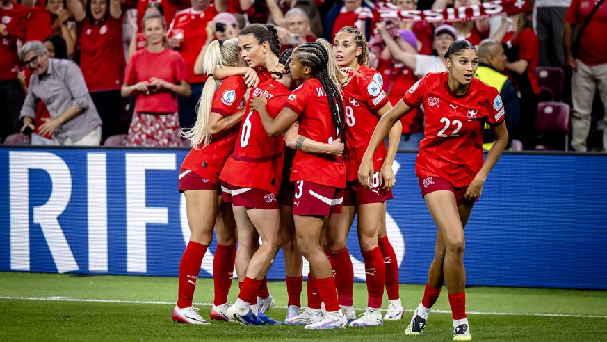 Switzerland&#039;s Riola Xhemaili, 2nd left, celebrates with teammates after scoring the 1:1 goal during the UEFA Women&#039;s EURO 2025 Group A soccer match between Finland and Switzerland at the Sta ...