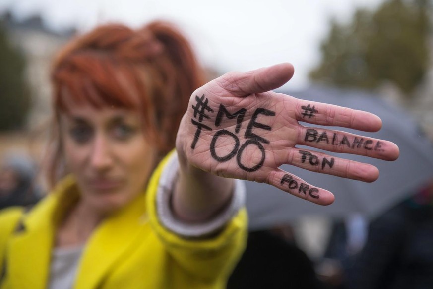 epa06296918 A woman shows a message reading &#039;#MeToo&#039; written on her hand during a rally against gender-based and sexual violence against women, in Paris, France, 29 October 2017. The hashtag ...