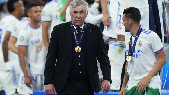 Real Madrid&#039;s head coach Carlo Ancelotti wears the medal after the Champions League final soccer match between Liverpool and Real Madrid at the Stade de France in Saint Denis near Paris, Saturday ...