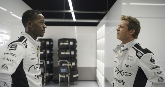 This image released by Apple TV+ shows Damson Idris as Joshua Pearce, left, and Brad Pitt as Sonny Hayes in a scene from &quot;F1 The Movie.&quot; (Apple TV+ via AP)
Film Review - F1 The Movie