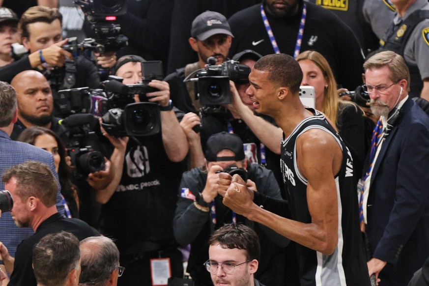 San Antonio Spurs forward Victor Wembanyama reacts after defeating the Oklahoma City Thunder in Game 7 of the Western Conference finals of the NBA basketball playoffs series Saturday, May 30, 2026, in ...