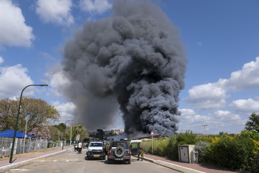 Smoke rises from a fire after rockets fired from Lebanon struck Bezet, northern Israel, Thursday, April 6, 2023. Militants in Lebanon have fired a heavy barrage of rockets at Israel, the Israeli milit ...