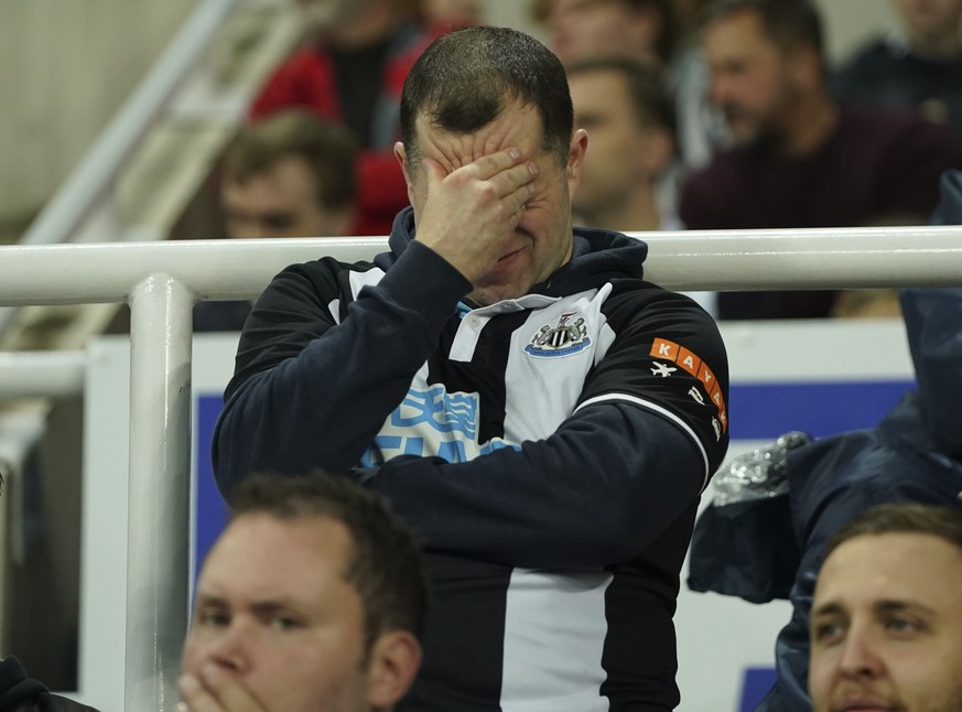 A Newcastle fan reacts during an English Premier League soccer match between Newcastle and Tottenham Hotspur at St. James&#039; Park in Newcastle, England, Sunday Oct. 17, 2021. (AP Photo/Jon Super)