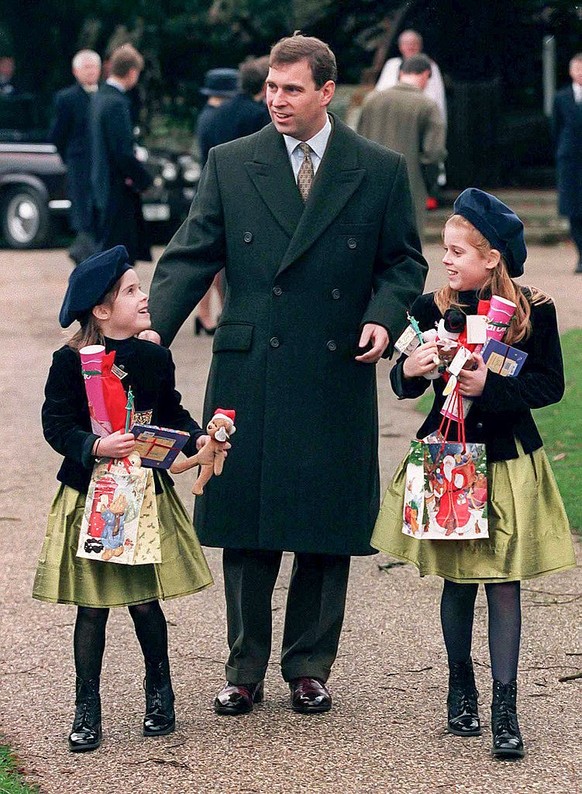 SANDRINGHAM, UNITED KINGDOM, - DECEMBER 25; Prince Andrew, Duke of York, with daughters Princess Beatrice, and Princess Eugenie attend the annual Christmas Day service at Sandringham Church, on Decemb ...