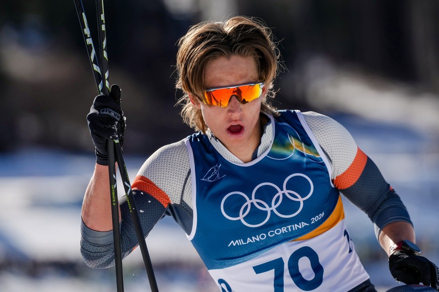 Individual neutral athlete Savelii Korostelev reacts after crossing the finish line in the cross country skiing men's 10km interval start free at the 2026 Winter Olympics, in Tesero, Italy, Frida ...