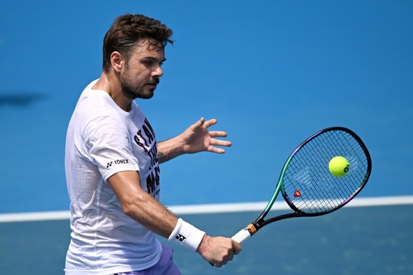 epa10391394 Stan Wawrinka of Switzerland in action during an Australian Open practice session at Melbourne Park in Melbourne, Australia, 06 January 2023. EPA/MORGAN HANCOCK AUSTRALIA AND NEW ZEALAND O ...