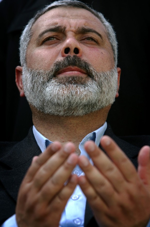Palestinian Authority Prime Minister Ismail Haniyeh, of the Islamic group Hamas, prays prior to his speech during a demonstration at the Jebaliya refugee camp next to Gaza City, Friday April 14, 2006. ...