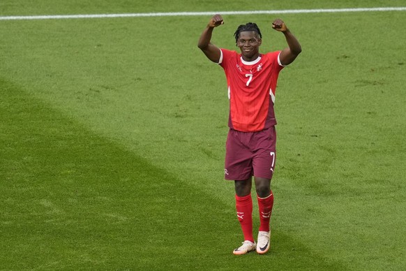 Switzerland&#039;s Breel Embolo celebrates after scoring his side&#039;s opening goal during a quarterfinal match between England and Switzerland at the Euro 2024 soccer tournament in Duesseldorf, Ger ...