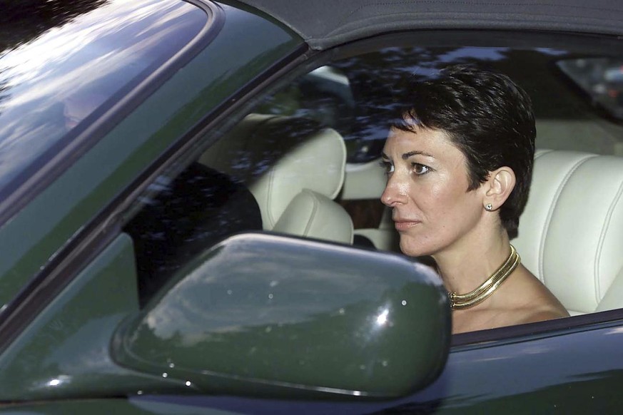 FILE - In this Sept. 2, 2000 file photo, British socialite Ghislaine Maxwell, driven by Britain's Prince Andrew leaves the wedding of a former girlfriend of the prince, Aurelia Cecil, at the Parish Ch ...