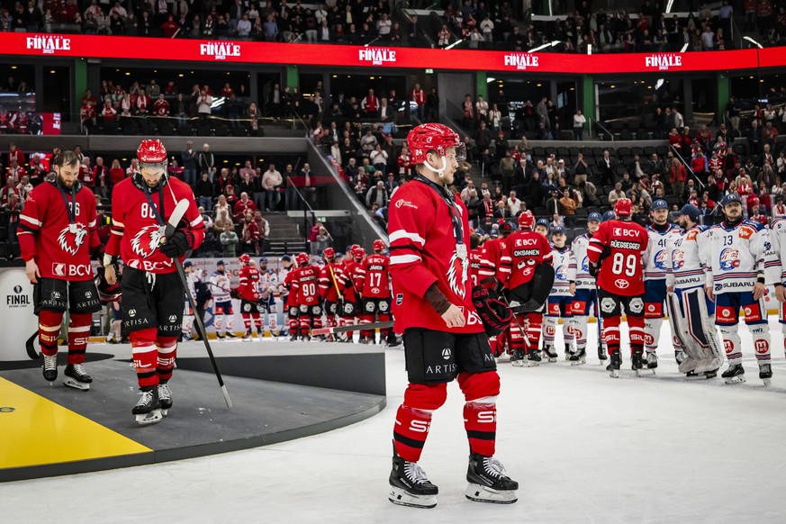 Lausanne HC players with Dominik Kahun react after losing the final during the fifth leg of the National League Swiss Championship final playoff game between Lausanne HC and ZSC Lions at the ice stadi ...
