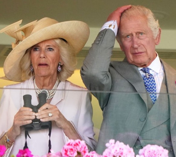 ASCOT, UNITED KINGDOM - JUNE 24: (EMBARGOED FOR PUBLICATION IN UK NEWSPAPERS UNTIL 24 HOURS AFTER CREATE DATE AND TIME) Queen Camilla, King Charles III and Lady Gabriella Windsor watch, from the Royal ...