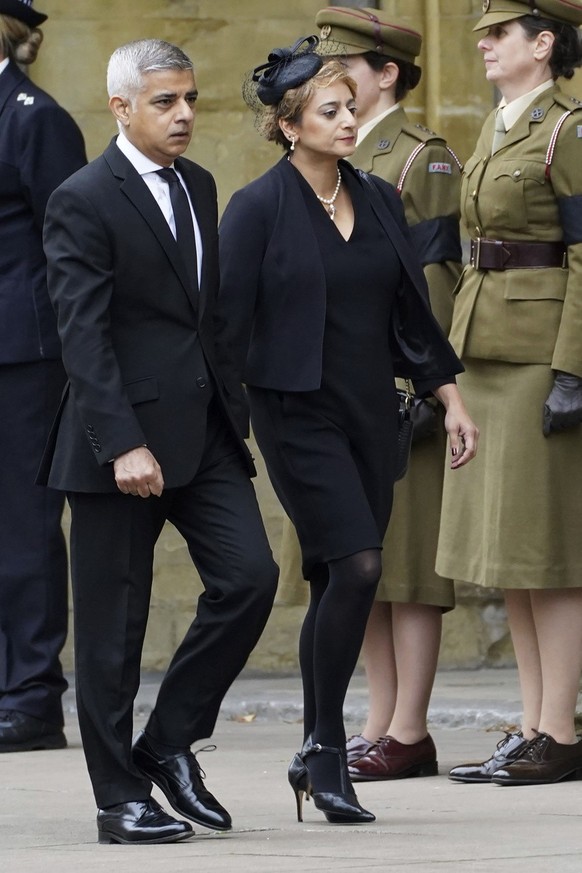 Mayor of London, Sadiq Khan, left, arrives with his wife, Saadiya Khan for the funeral service of Queen Elizabeth II at Westminster Abbey for her funeral in central London, Monday, Sept. 19, 2022. The ...