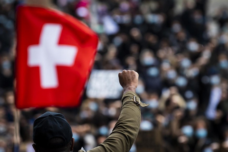 People demonstrate against racism after the worldwide movement of the Black Lives Matter (BLM) protest against the recent death of George Floyd in Lausanne, Switzerland, Saturday, June 13, 2020. (KEYS ...