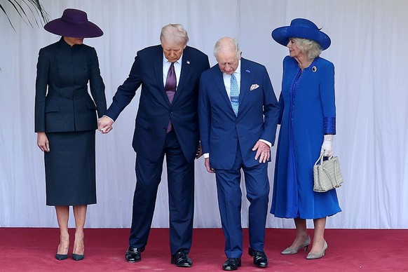 WINDSOR, ENGLAND - SEPTEMBER 17: First Lady Melania Trump, U.S. President Donald Trump, King Charles III and Queen Camilla during the State visit by the President of the United States of America at Wi ...
