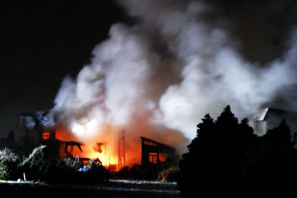 epa12579509 A house burns after a powerful earthquake in Aomori, northeastern Japan, early 09 December 2025. A powerful quake with a magnitude of 7.5 hit northeastern Japan late 08 December 2025 trigg ...