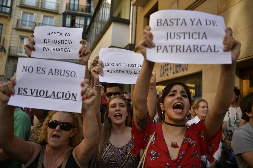 People hold up signs reading, &#039;&#039;It is not an abuse. It&#039;s rape&#039;&#039;, left, and &#039;&#039;Enough of patriarchal justice&#039;&#039; while protesting against sexual abuse sentence ...