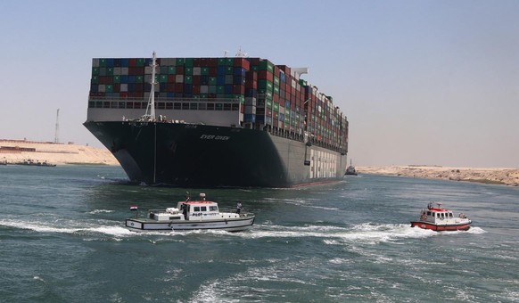 epa09328708 After reaching a settlement between Egypt&#039;s Suez Canal Authority and the owner, the Ever Given ship set to sail from Great Bitter Lake near Ismailia Governorate, Egypt, 07 July 2021.  ...