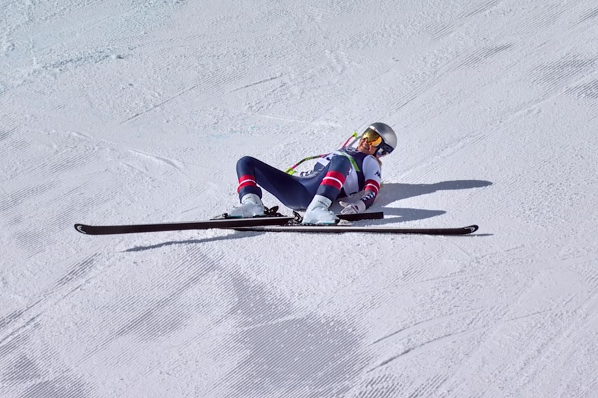 In this image taken from video provided by Olympic Broadcasting Services, OBS, United States' Lindsey Vonn lays on the course after crashing during an alpine ski women's downhill race, at th ...