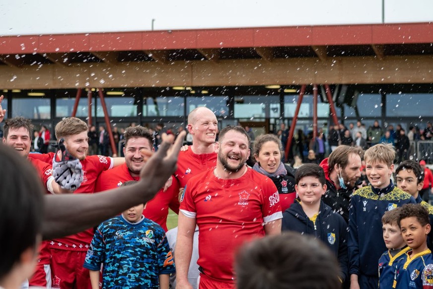 PLAN-LES-OUATES, SWITZERLAND - MARCH 12: Switzerland players and fans celebrate the win after the Rugby Europe Men's Trophy between Switzerland v Belgium at Centre sportif des Cherpines on March  ...