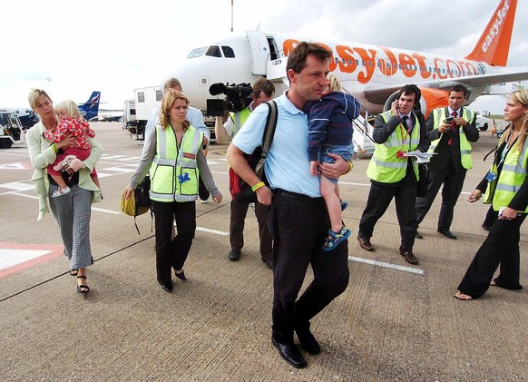 Kate and Gerry McCann, with twins Sean and Amelie, arrive at East Midlands airport in England, Sunday, Sept. 9 2007. The British couple named as suspects in the disappearance of their 4-year-old daugh ...