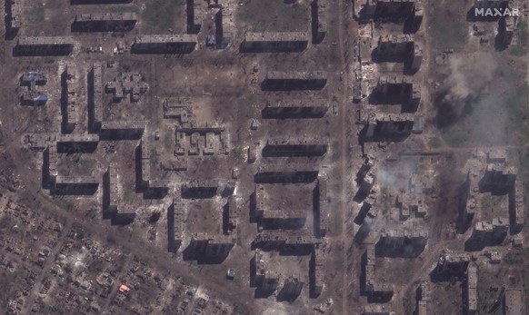 This satellite image provided by MaxarTechnologies shows demolished bakhmut school and smoldering- partment buildings in Bakhmut, Ukraine, Monday, May 15, 2023. (Satellite image �2023 Maxar Technologi ...