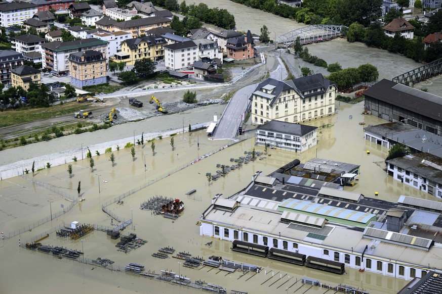 A view of the Rhone river, at right, and the Navizence river, following the storms that caused major flooding, in Chippis, Switzerland, Sunday, June 30, 2024. The Rhone river burst its banks in severa ...