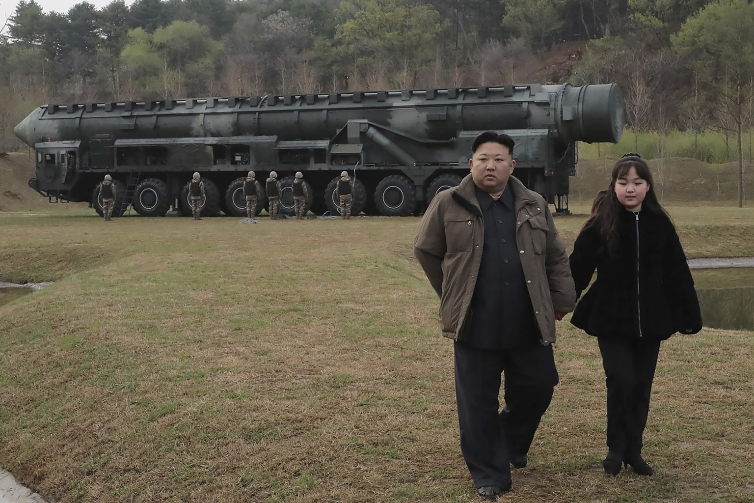 This photo provided April 14, 2023, by the North Korean government, shows North Korean leader Kim Jong Un, second right, and his daughter, inspect what it says is the test-launch of Hwasong-18 interco ...