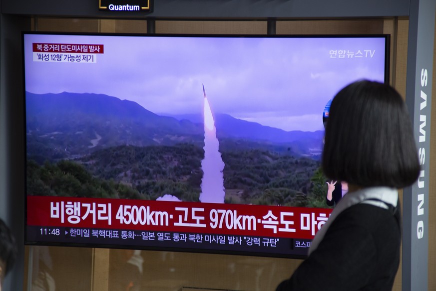 epa10222065 A woman watches the news at a station in Seoul, South Korea, 04 October 2022. According to South Korea&#039;s Joint Chiefs of Staff (JCS), North Korea launched a ballistic missile over Jap ...