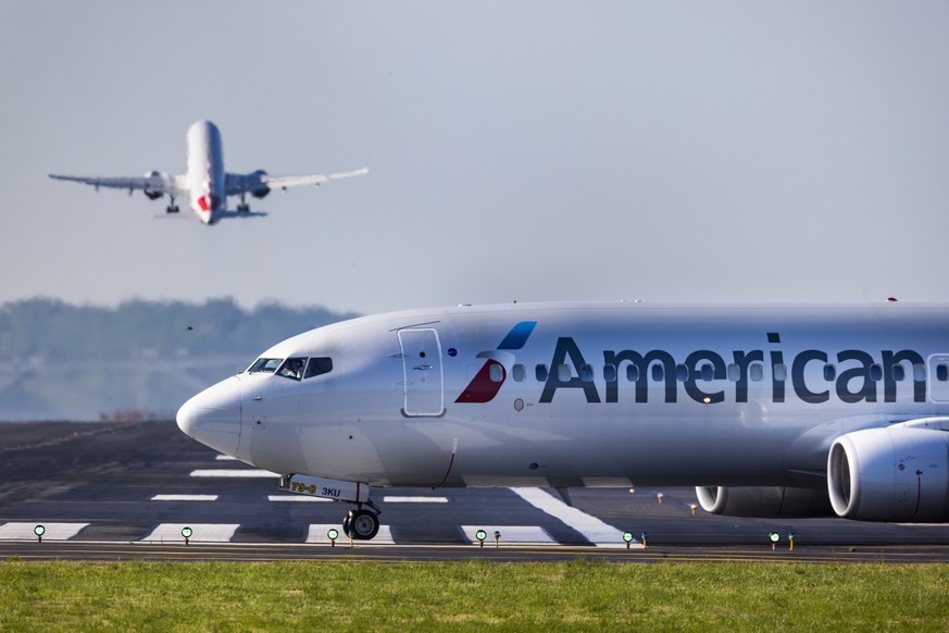 epa09177460 An American Airlines flight taxis to the runway prior to departing Ronald Reagan Washington National Airport in Arlington, Virginia, USA, 04 May 2021. With a surge in travel demand, US air ...