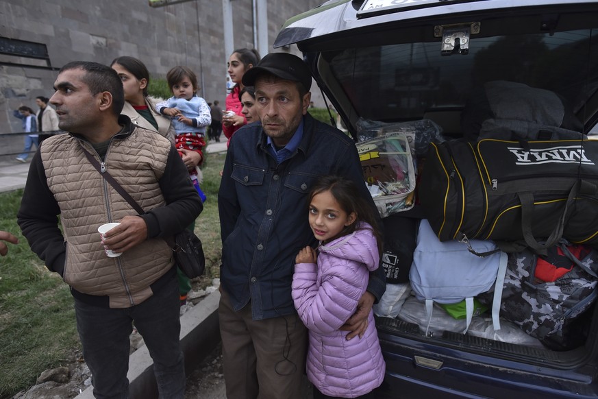 epa10884856 Ethnic Armenians from Nagorno-Karabakh wait gathering near a Red Cross registration centre in Goris, Armenia, 26 September 2023. Azerbaijan on 19 September 2023 launched a brief military o ...