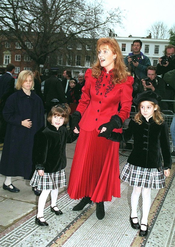 LONDON, UNITED KINGDOM - DECEMBER 18: Duchess Of York With Her Daughters Princess Beatrice And Princess Eugenie Attending Christmas Pantomime &#039;cinderalla&#039; In Aid Of Children In Crisis Of Whi ...