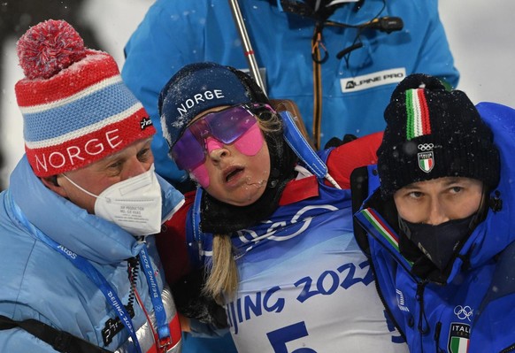 epa09751867 Ingrid Landmark Tandrevold of Norway reacts during the Women&#039;s Biathlon 10km Pursuit race at the Zhangjiakou National Biathlon Centre at the Beijing 2022 Olympic Games, Zhangjiakou, C ...