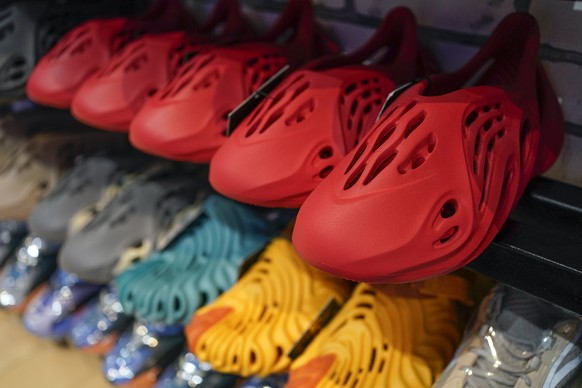 Yeezy shoes made by Adidas are displayed at Laced Up, a sneaker resale store, in Paramus, N.J., Tuesday, Oct. 25, 2022. Adidas has ended its partnership with the rapper formerly known as Kanye West ov ...