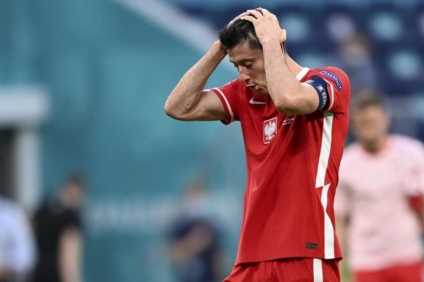 Poland&#039;s Robert Lewandowski reacts at the end of the Euro 2020 soccer championship group D match between Sweden and Poland, at the St. Petersburg stadium in St. Petersburg, Russia, Wednesday, Jun ...