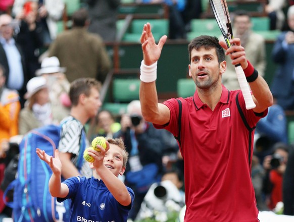 IMAGO / Kyodo News

Djokovic advances to French Open semis for sixth straight year Novak Djokovic (R) of Serbia celebrates with a ball boy after defeating Tomas Berdych of Czech Republic 6-3, 7-5, 6-3 ...