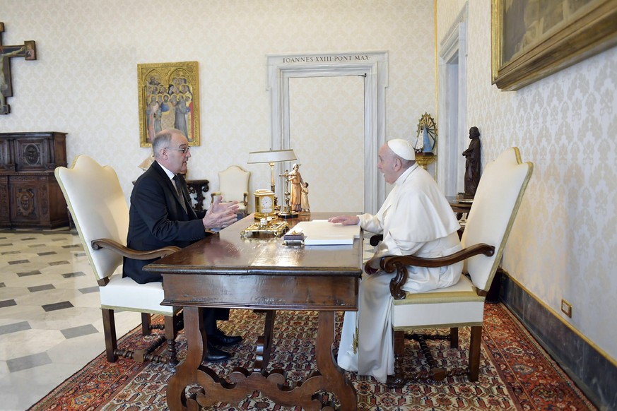 epa09180809 A handout picture provided by the Vatican Media shows Pope Francis (R) during a private audience with President of the Swiss Confederation Guy Parmelin, at the Vatican, Vatican City, 06 Ma ...