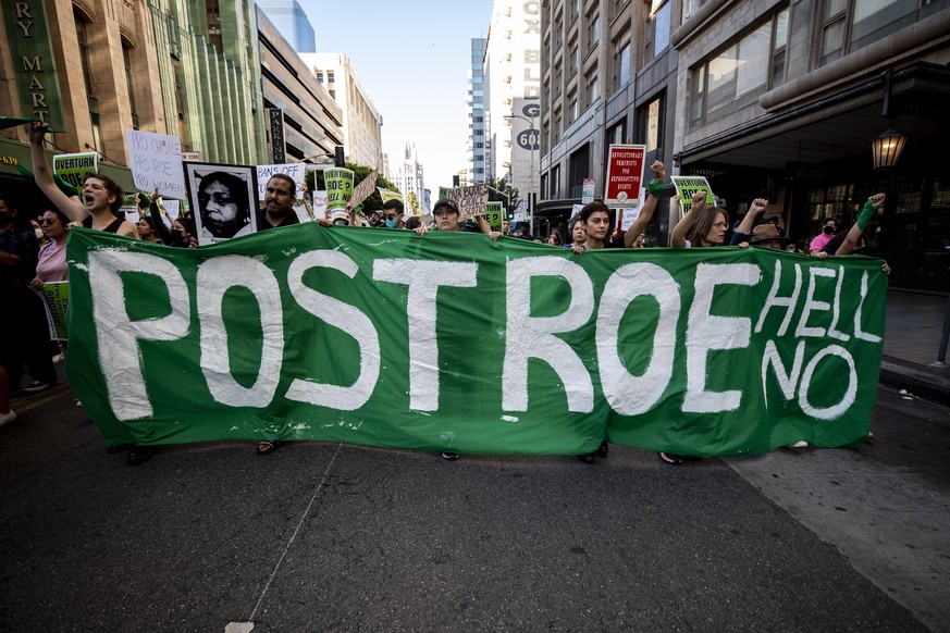 epa10033088 Pro-choice demonstrators protest following the decision by the US Supreme Court to overturn the Roe v. Wade ruling, in Los Angeles, California, 24 June 2022. The US Supreme Court ruled on  ...